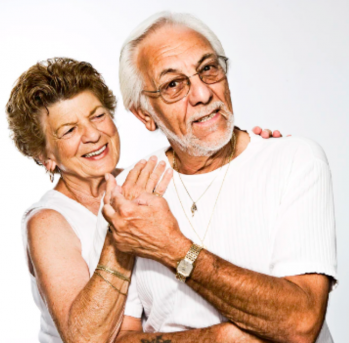 Elderly couple holding hands